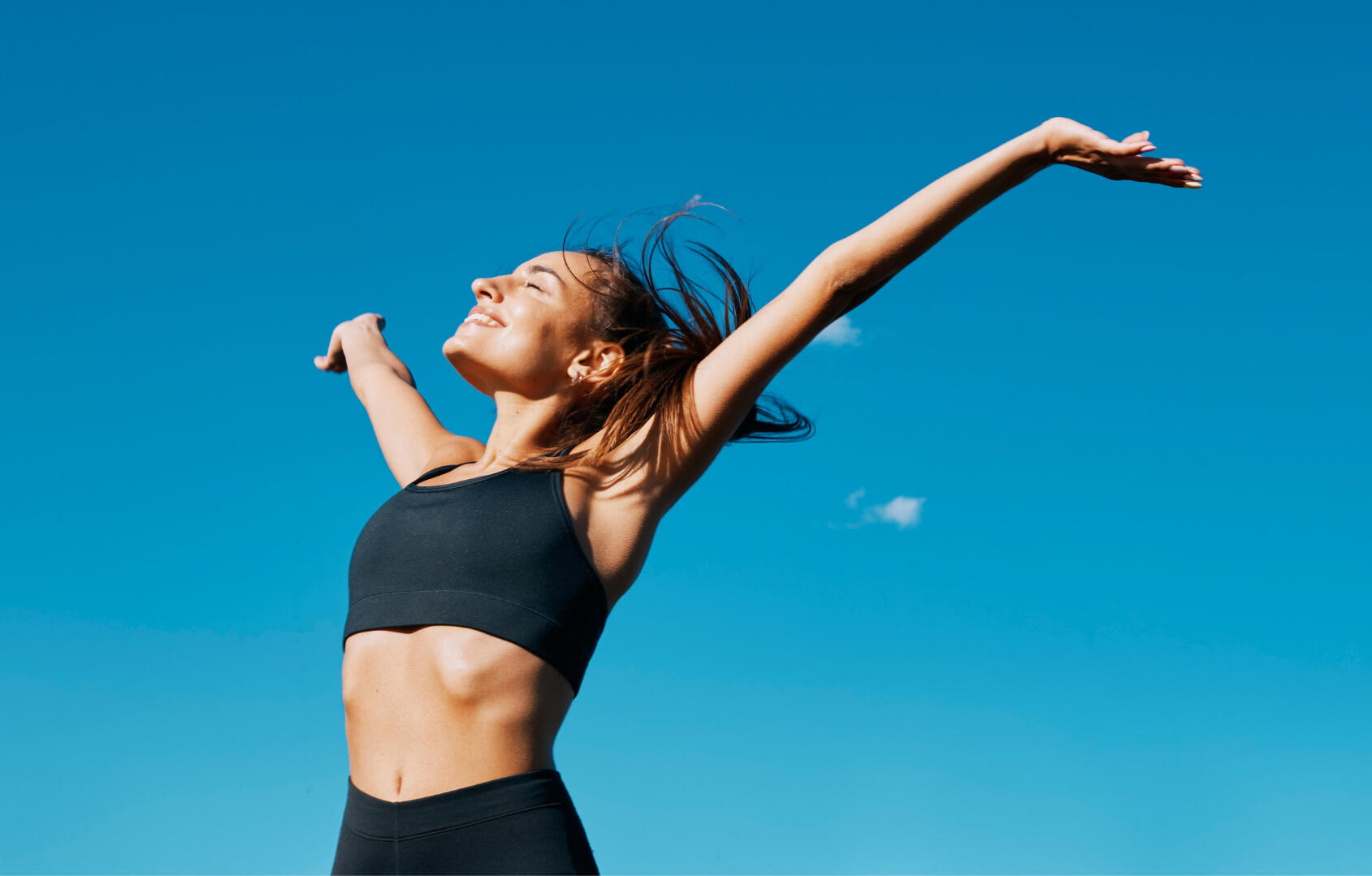 woman stretching arms out